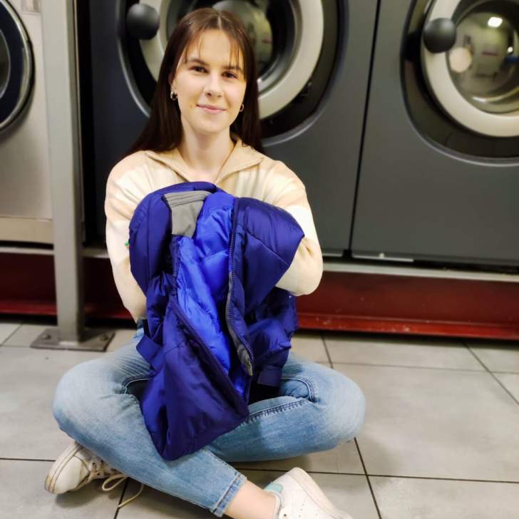 Washing a down jacket in a launderette in Krakow.